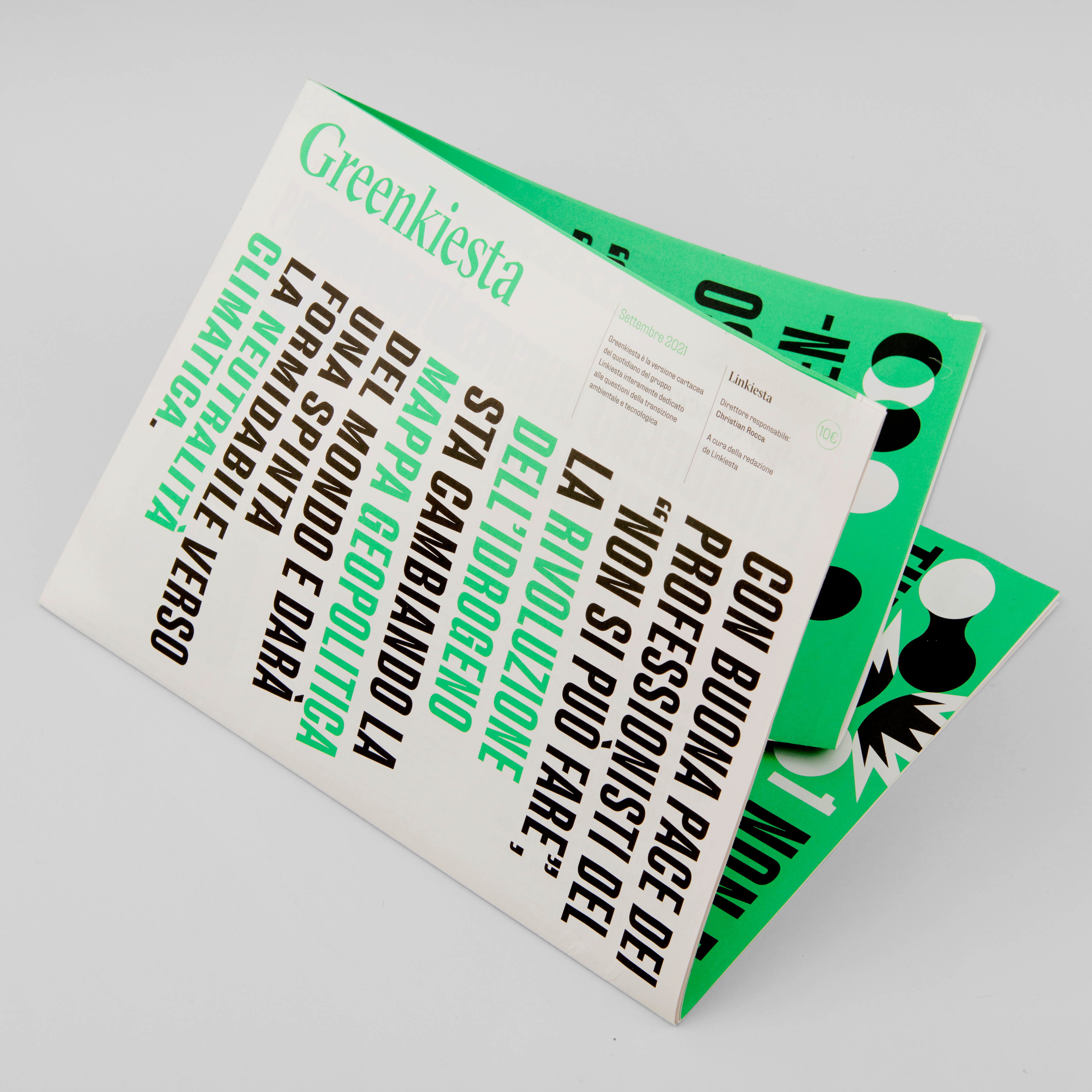 Greenkiesta magazine laying on a white surface