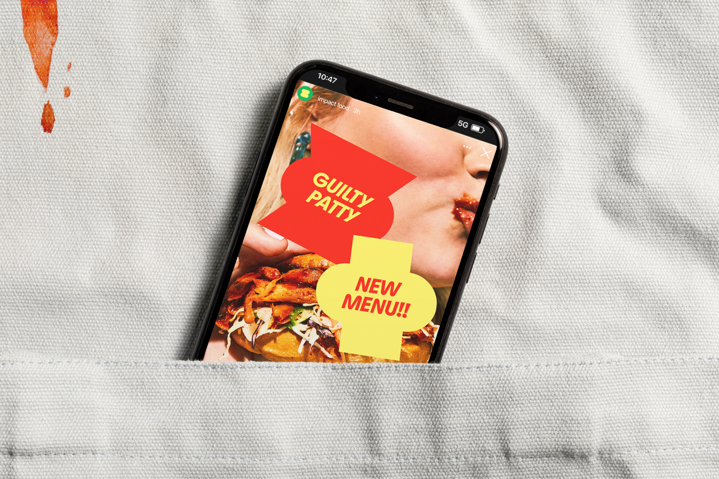 Smartphone with an instagram story from Impact hanging from a pocket